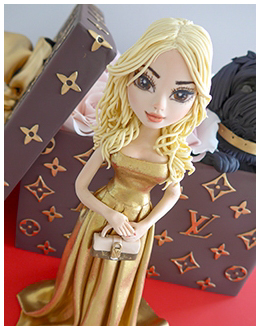 Louis Vuitton novelty cake with a glamour girl and pet dog